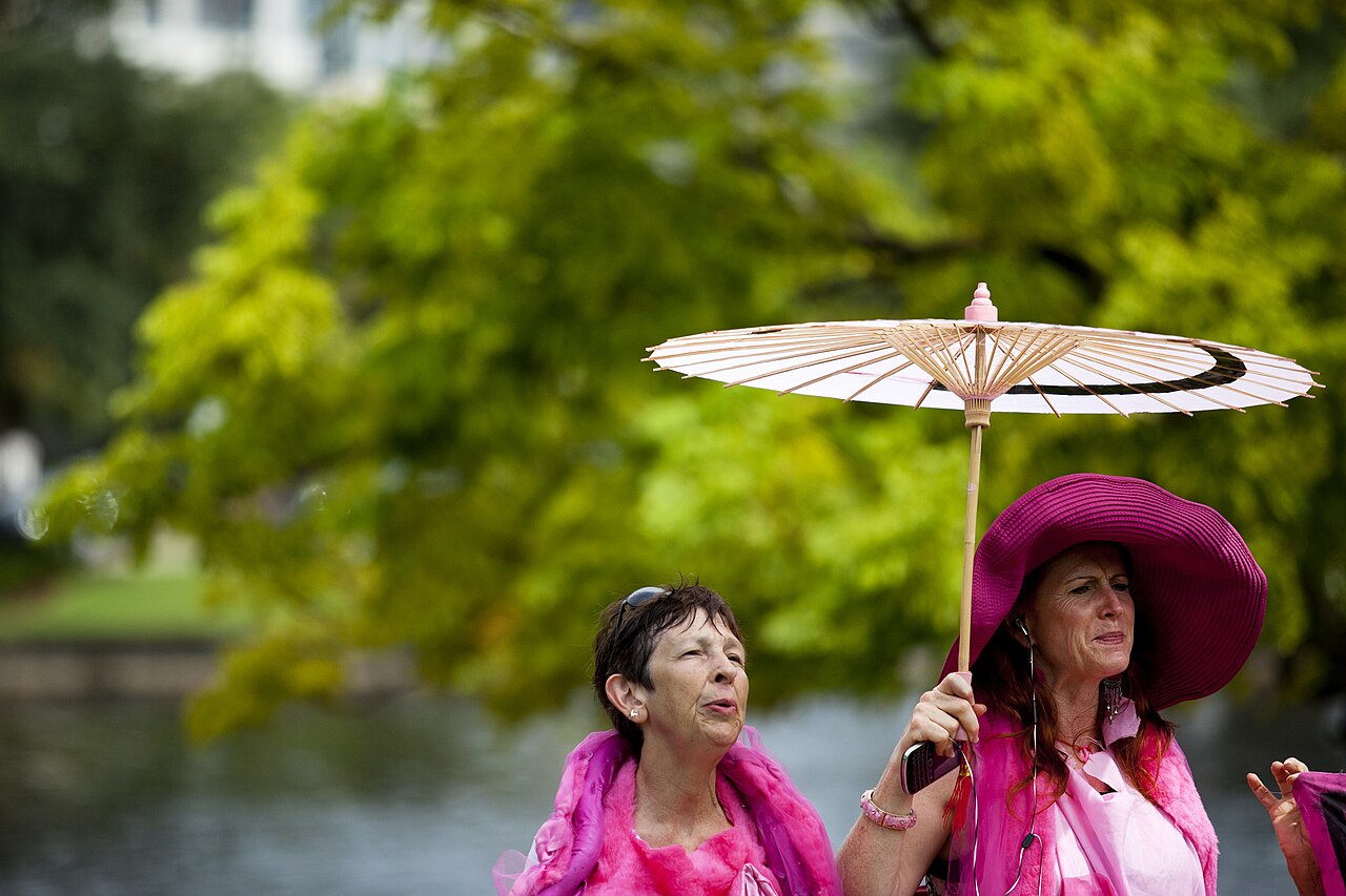 Jodie Evans, co-founder of CodePink, singing at a Planned Parenthood rally alongside Edwina Vogan / Mallory Benedict/PBS Newshour