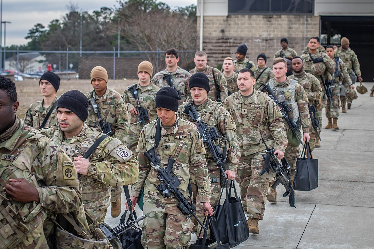 Soldiers from the 82nd Airborne Division and the 18th Airborne Corps file onto a U.S. Air Force C-17 Globemaster III aircraft for deployment / U.S. Army