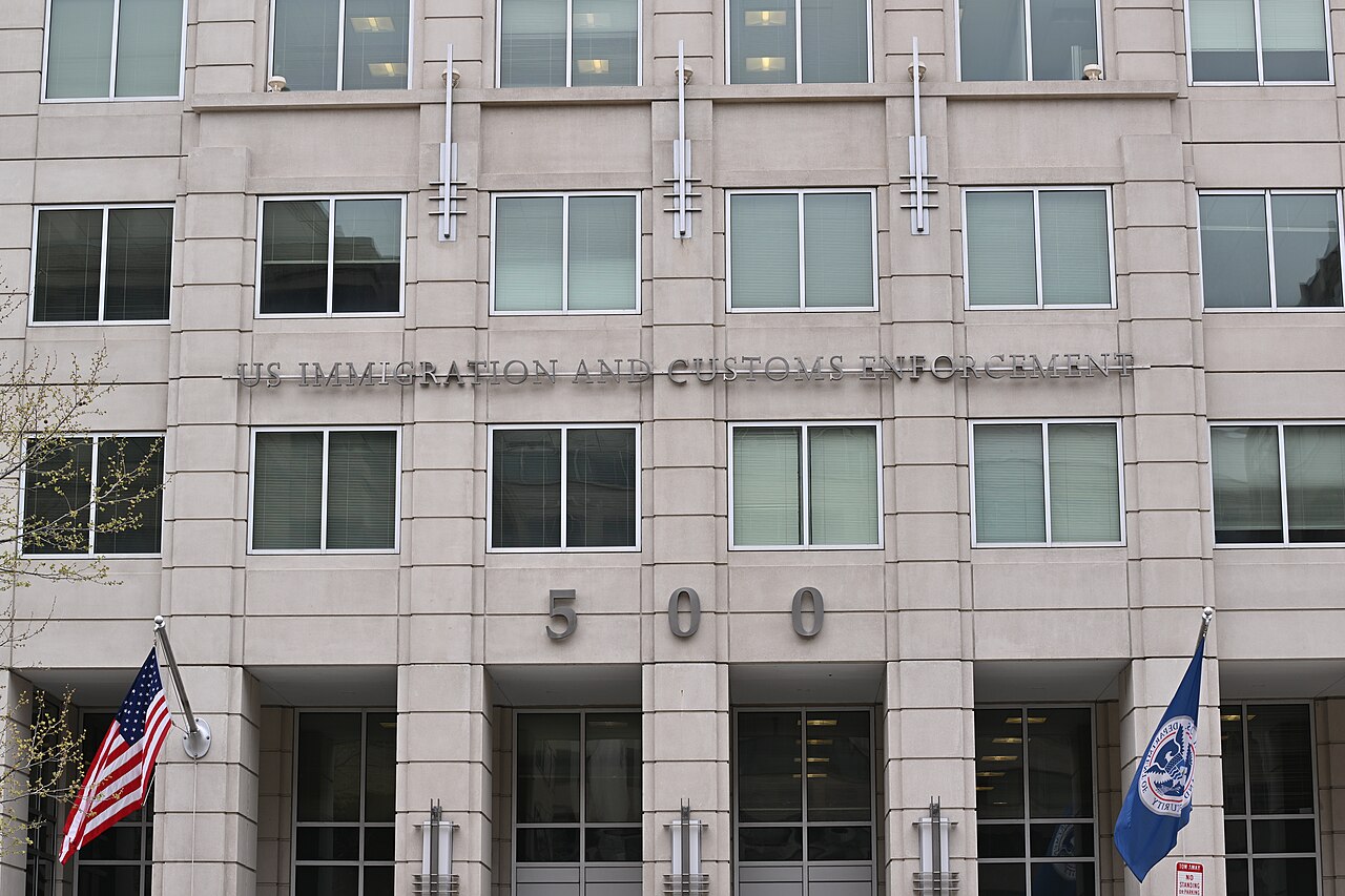 ICE building exterior with flags and signage at 500 12th Street SW, Washington DC / DHS Photo