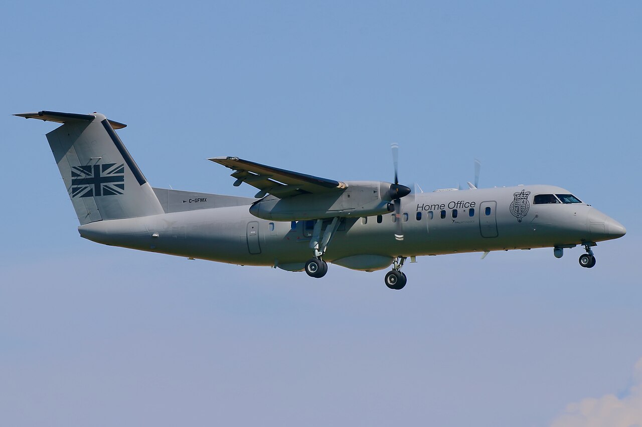 ISR PAL Provincial Airlines DHC Dash 8-300 aircraft landing at Lydd airport, contracted by UK Government for English Channel migrant boat surveillance patrols / Wikimedia Commons
