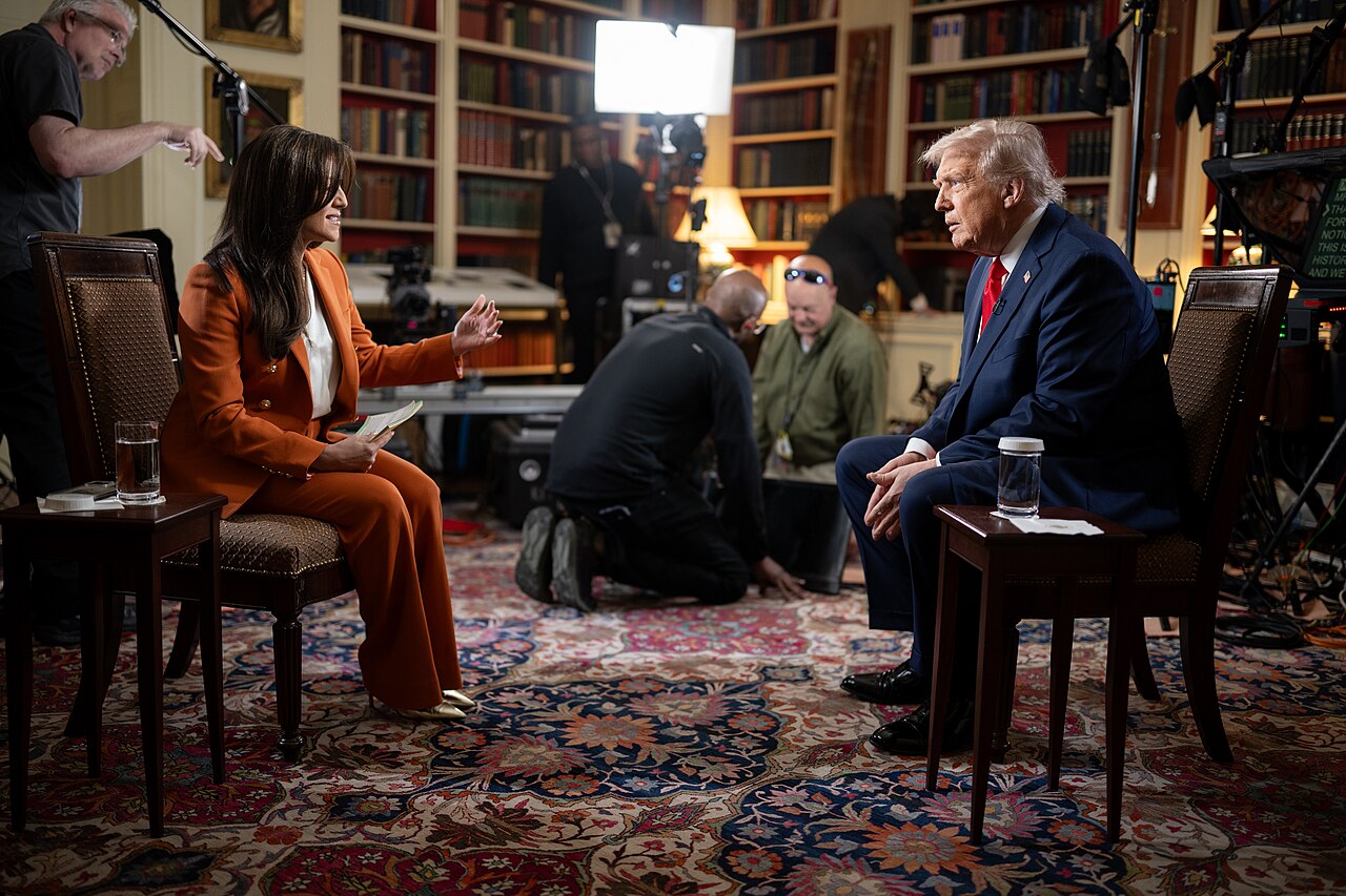 President Donald Trump sitting for an interview with Fox News journalist Rachel Campos Duffy / US Navy via Wikimedia Commons