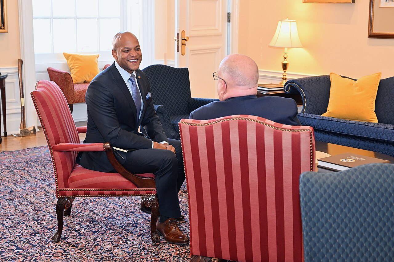 Governor-Elect Wes Moore standing at the Maryland State House in Annapolis, wearing a suit and tie with the State House interior visible in the background / Joe Andrucyk, Governor's Office