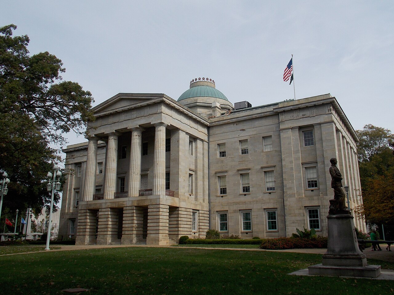 North Carolina State Capitol Building in Raleigh, the seat of state government where immigration legislation was debated and veto overrides occurred / Public domain