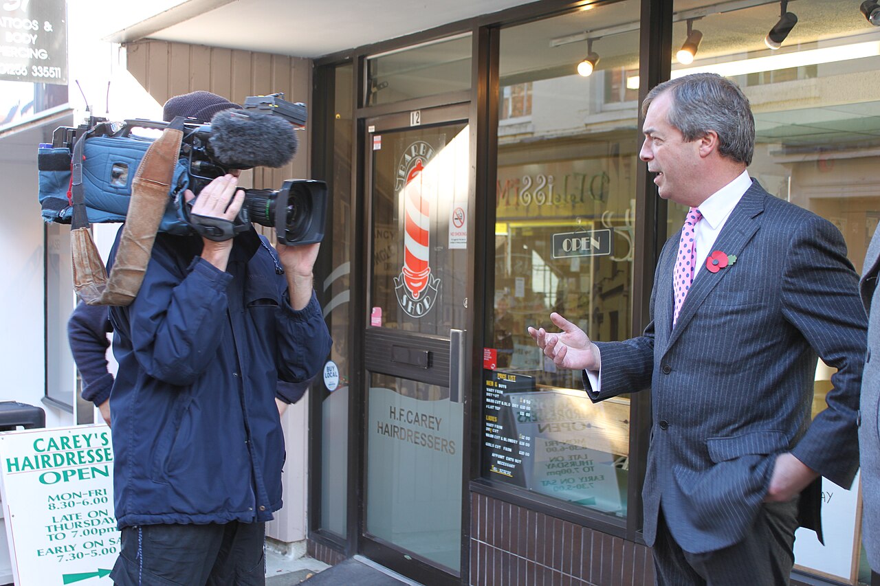 Nigel Farage speaking to members of the media / No attribution listed